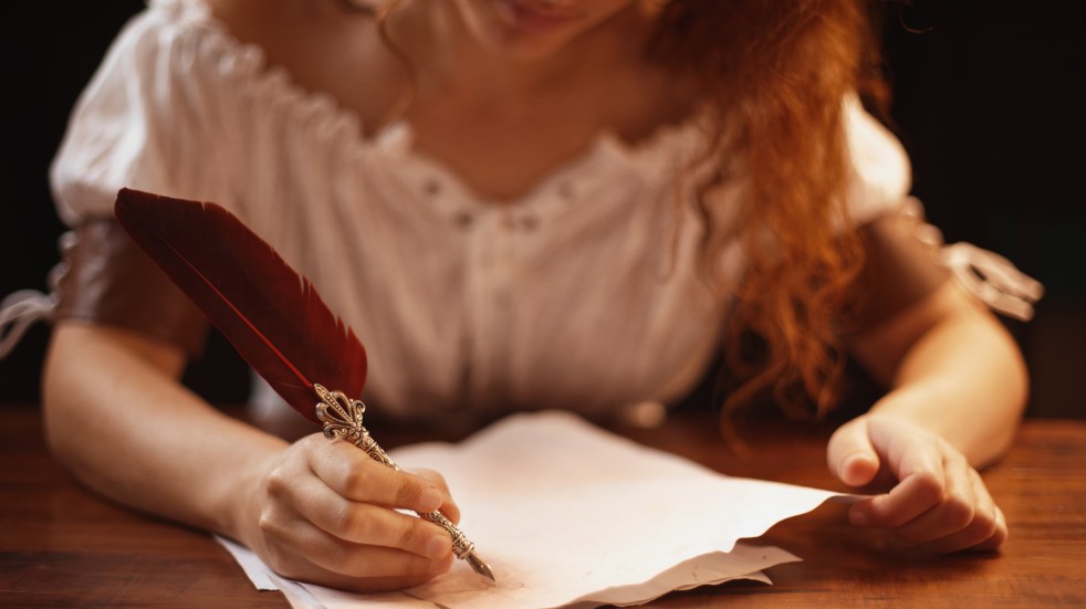 Woman writing with quill